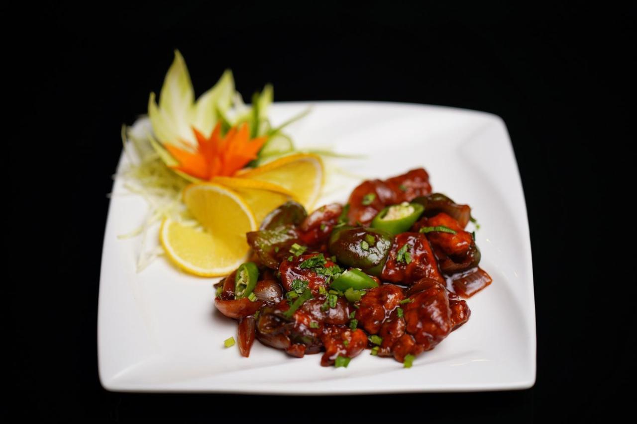 Elephant Passage Munnar Exteriör bild A plate of chilli chicken