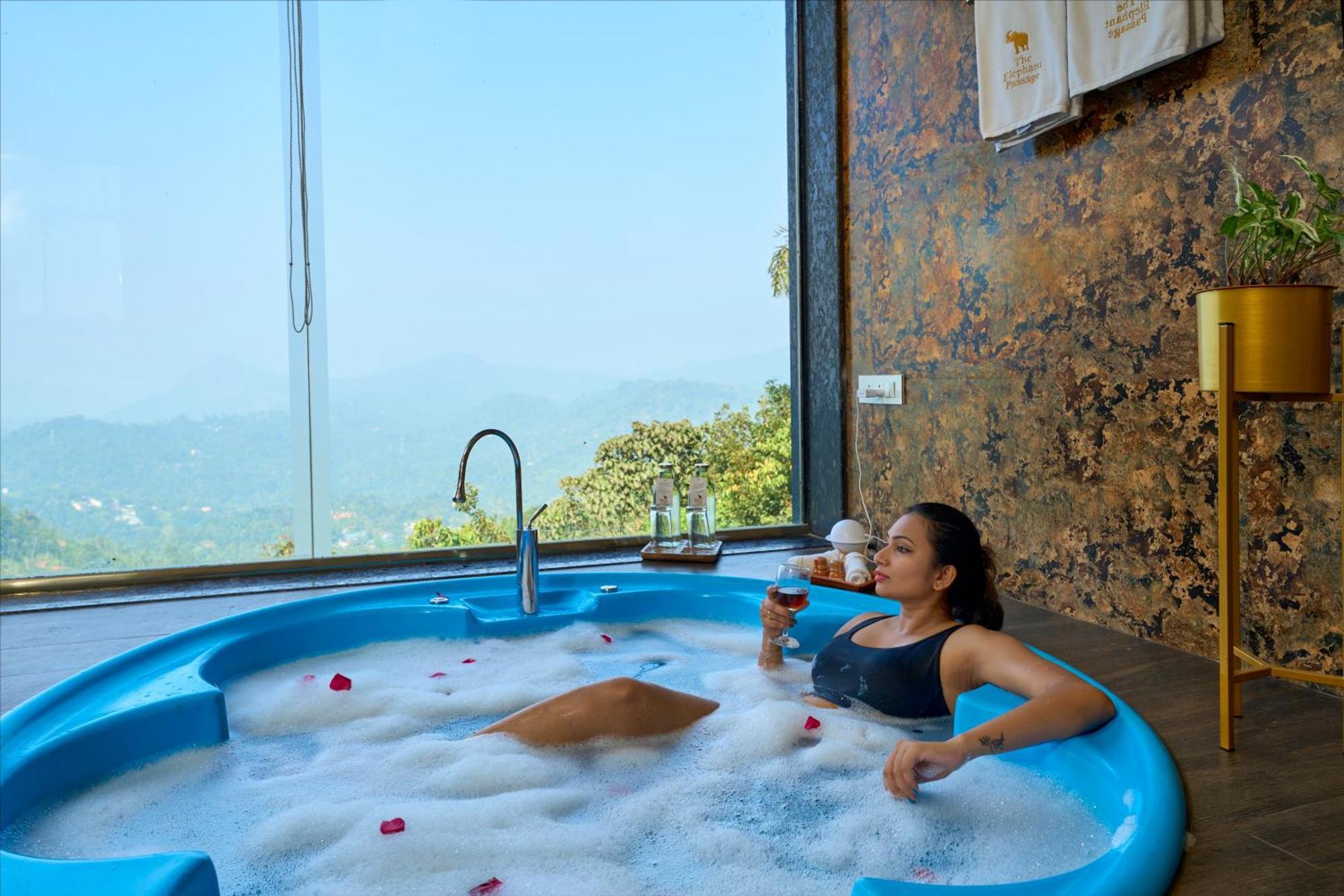 Elephant Passage Munnar Exteriör bild A woman relaxing in a spa